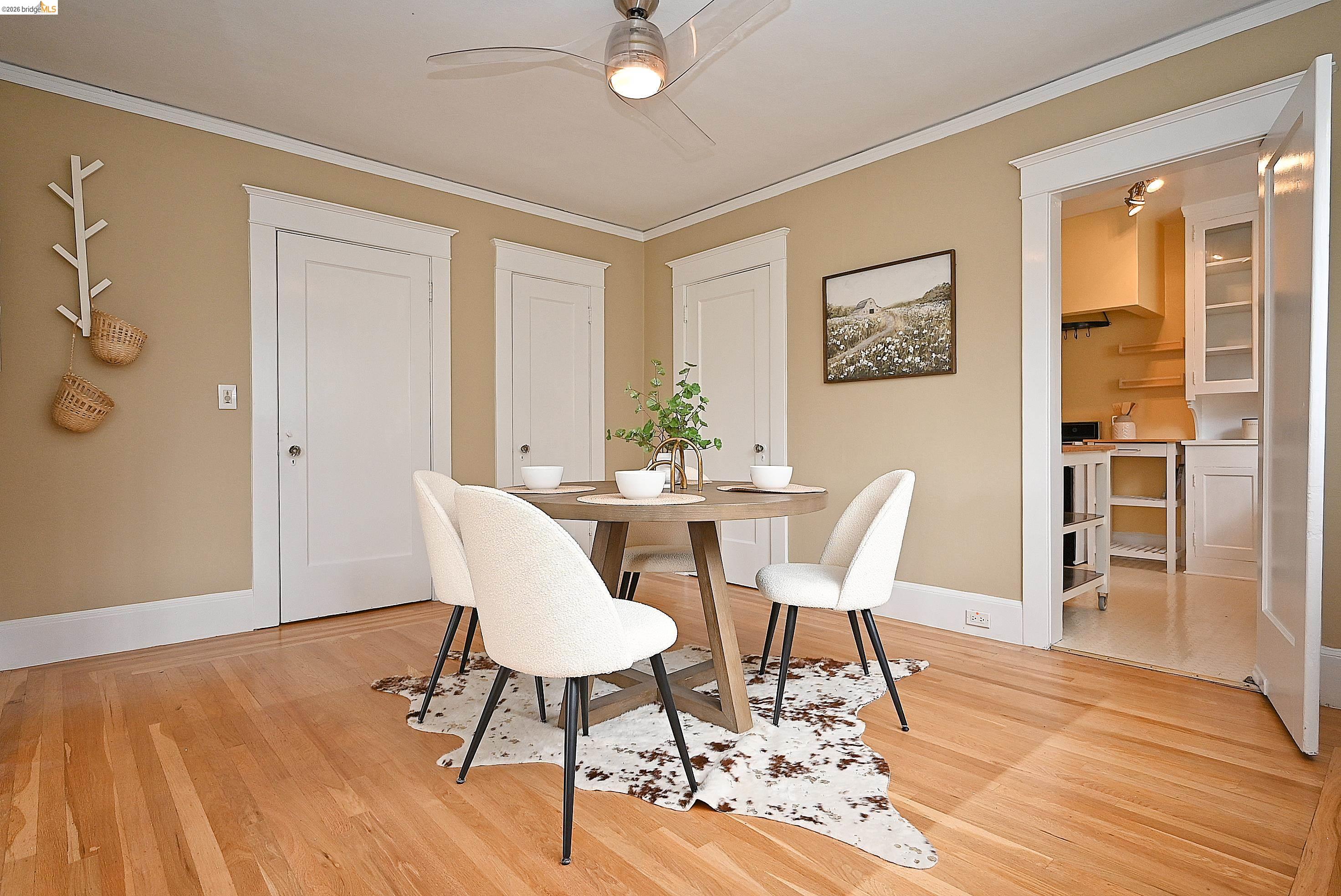 1301 Bonita Avenue, Unit 3 Berkeley, CA 94709 - Photo 21 of 48 Dining room featuring hardwood floors, a ceiling fan with integrated lighting.