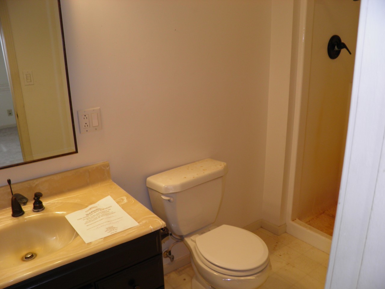 2264 Ridgeview Drive Muscatine, IA 52761 - Photo 17 of 33 a white toilet sitting next to a bathroom sink