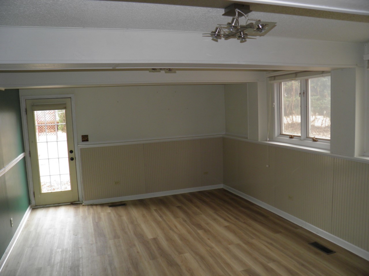 2264 Ridgeview Drive Muscatine, IA 52761 - Photo 21 of 33 wooden floor in an empty room with a window