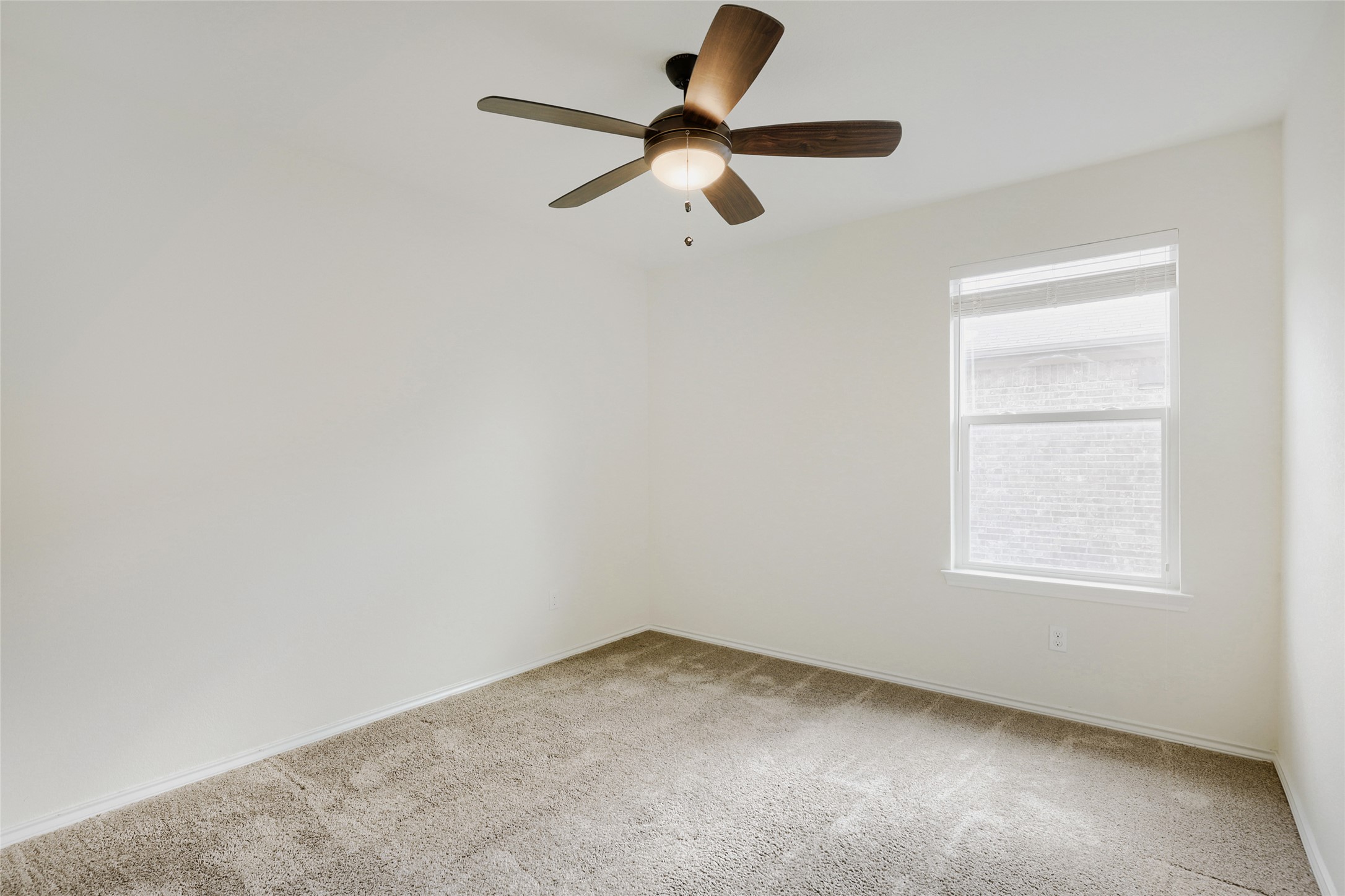 104 Kavanaugh Street Georgetown, TX 78628 - Photo 22 of 30 Bedroom 2 with ceiling fan and blinds
