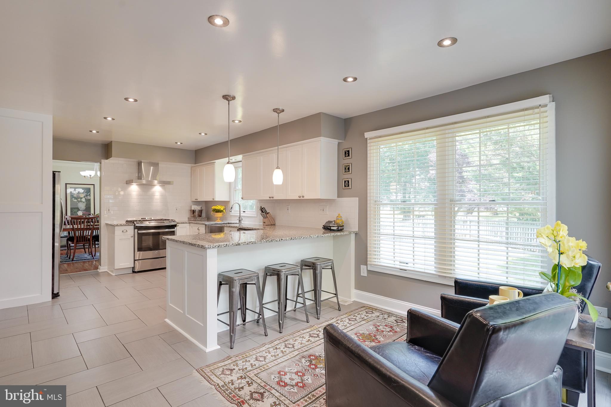 701 Stratford Manor Terrace Silver Spring, MD 20905 - Photo 13 of 43 a living room with stainless steel appliances granite countertop furniture and a kitchen view