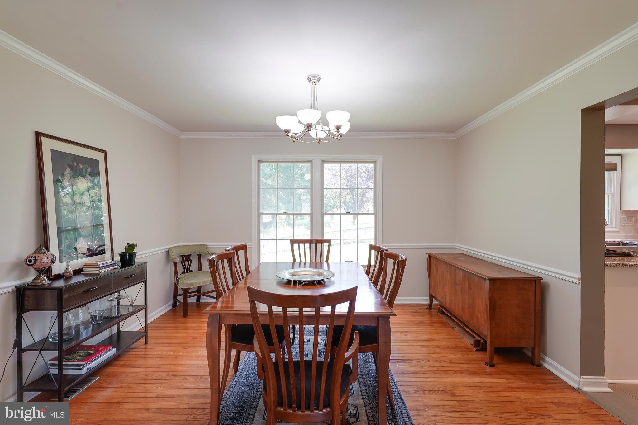 701 Stratford Manor Terrace Silver Spring, MD 20905 - Photo 7 of 43 a view of a dining room with furniture window and wooden floor