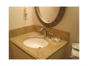 6115 Via Laguna Lane Boca Raton, FL 33433 - Photo 3 of 14 a bathroom with a sink and a mirror