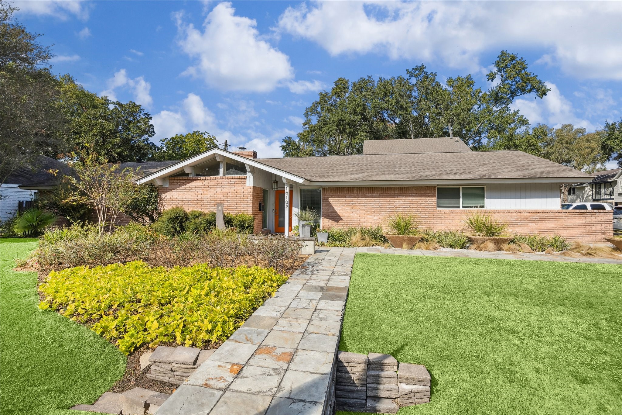 10102 Knoboak Drive Houston, TX 77080 - Photo 2 of 39 a front view of a house with a yard