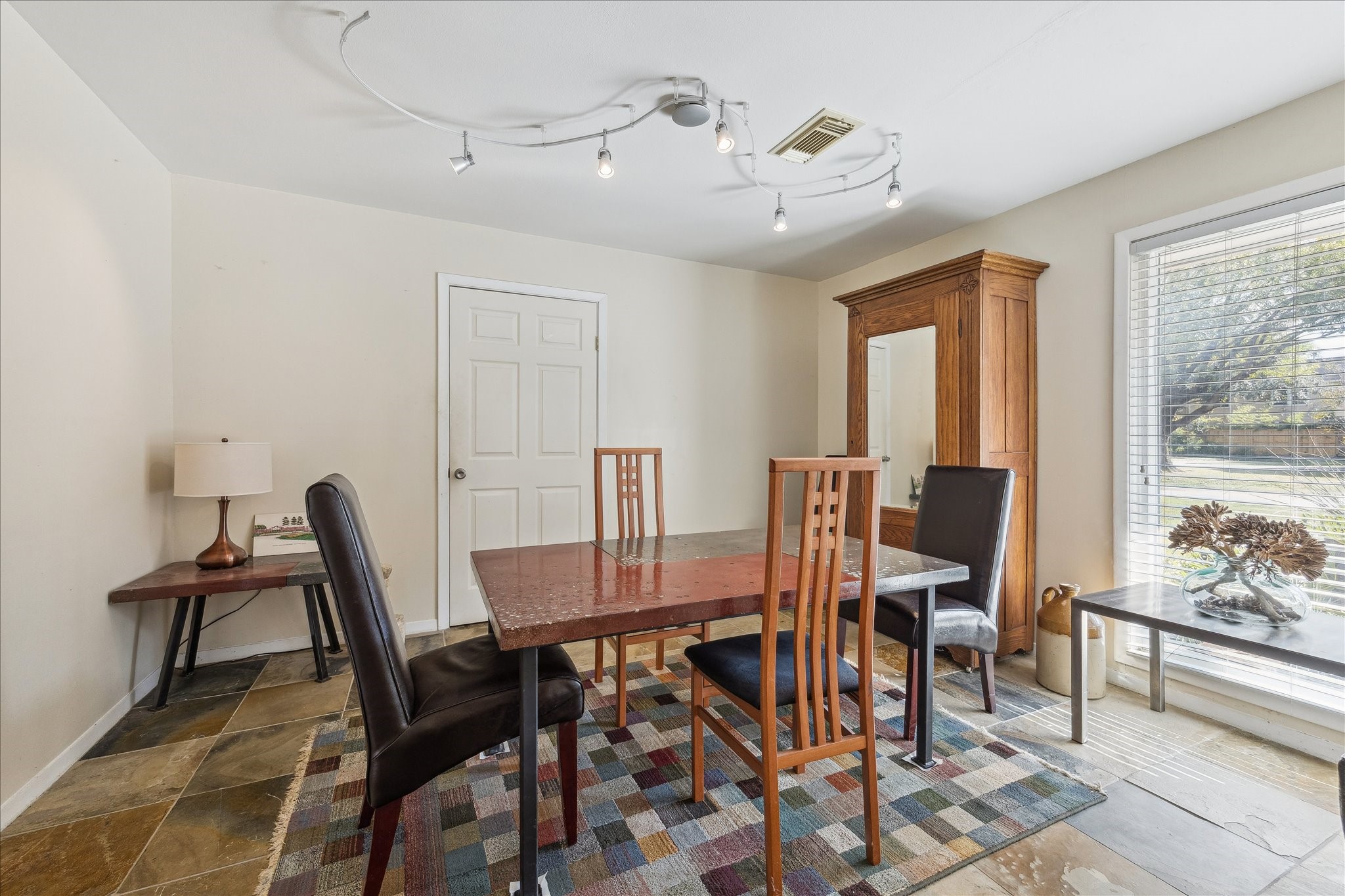 10102 Knoboak Drive Houston, TX 77080 - Photo 21 of 39 a view of a dining room with furniture and a window