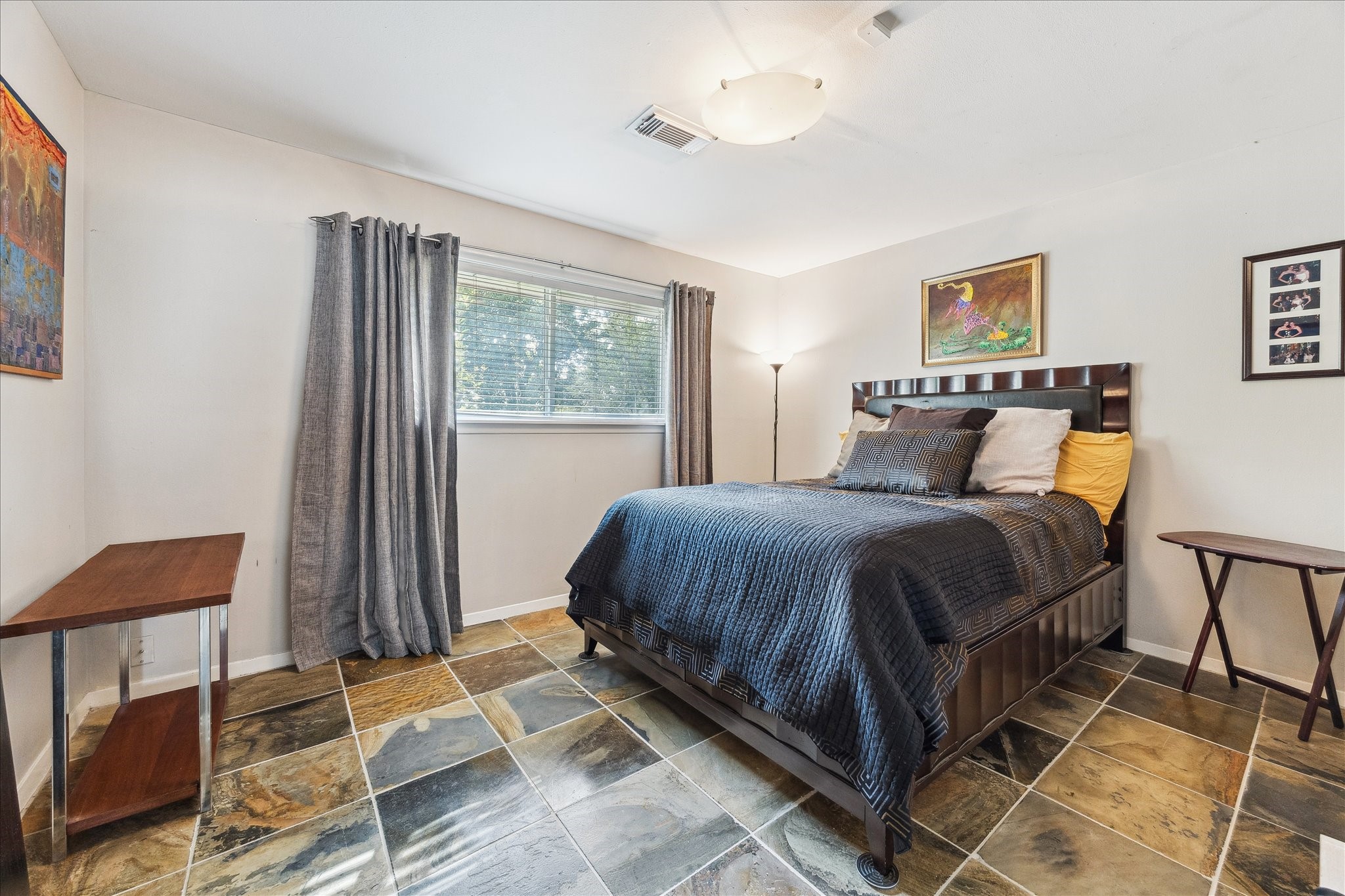 10102 Knoboak Drive Houston, TX 77080 - Photo 24 of 39 a bedroom with a bed and wooden floor