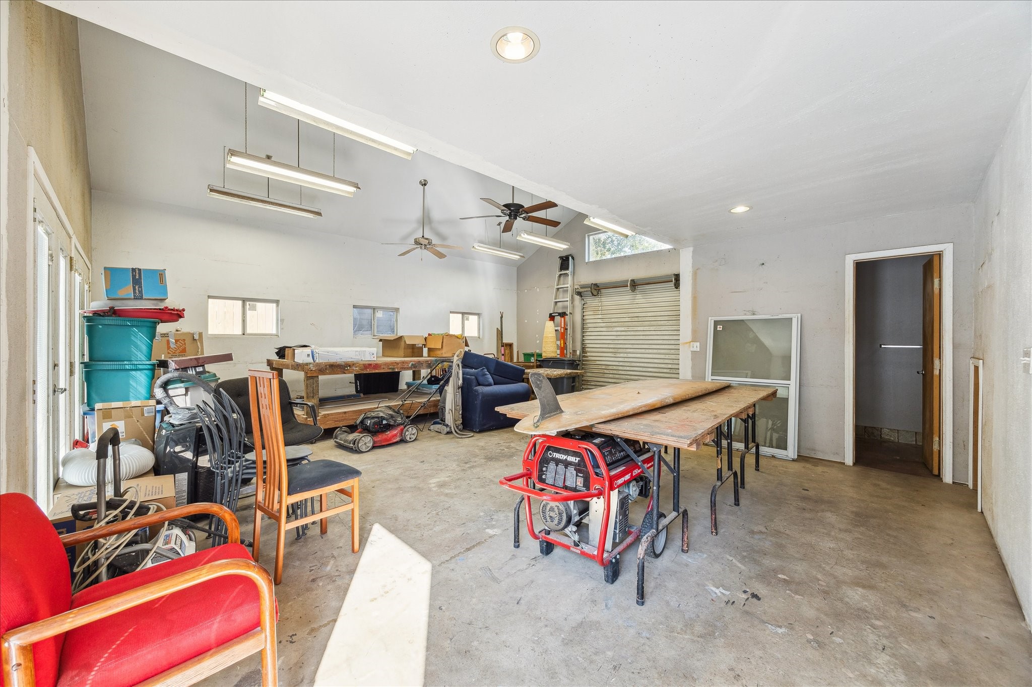 10102 Knoboak Drive Houston, TX 77080 - Photo 27 of 39 a room with lots of furniture and clutter