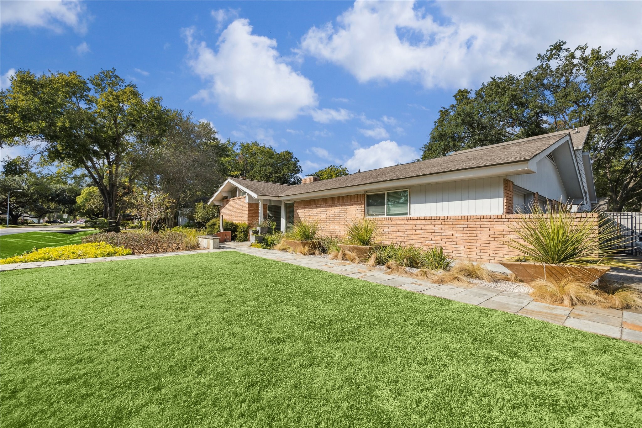 10102 Knoboak Drive Houston, TX 77080 - Photo 3 of 39 a front view of house with yard and trees in the background