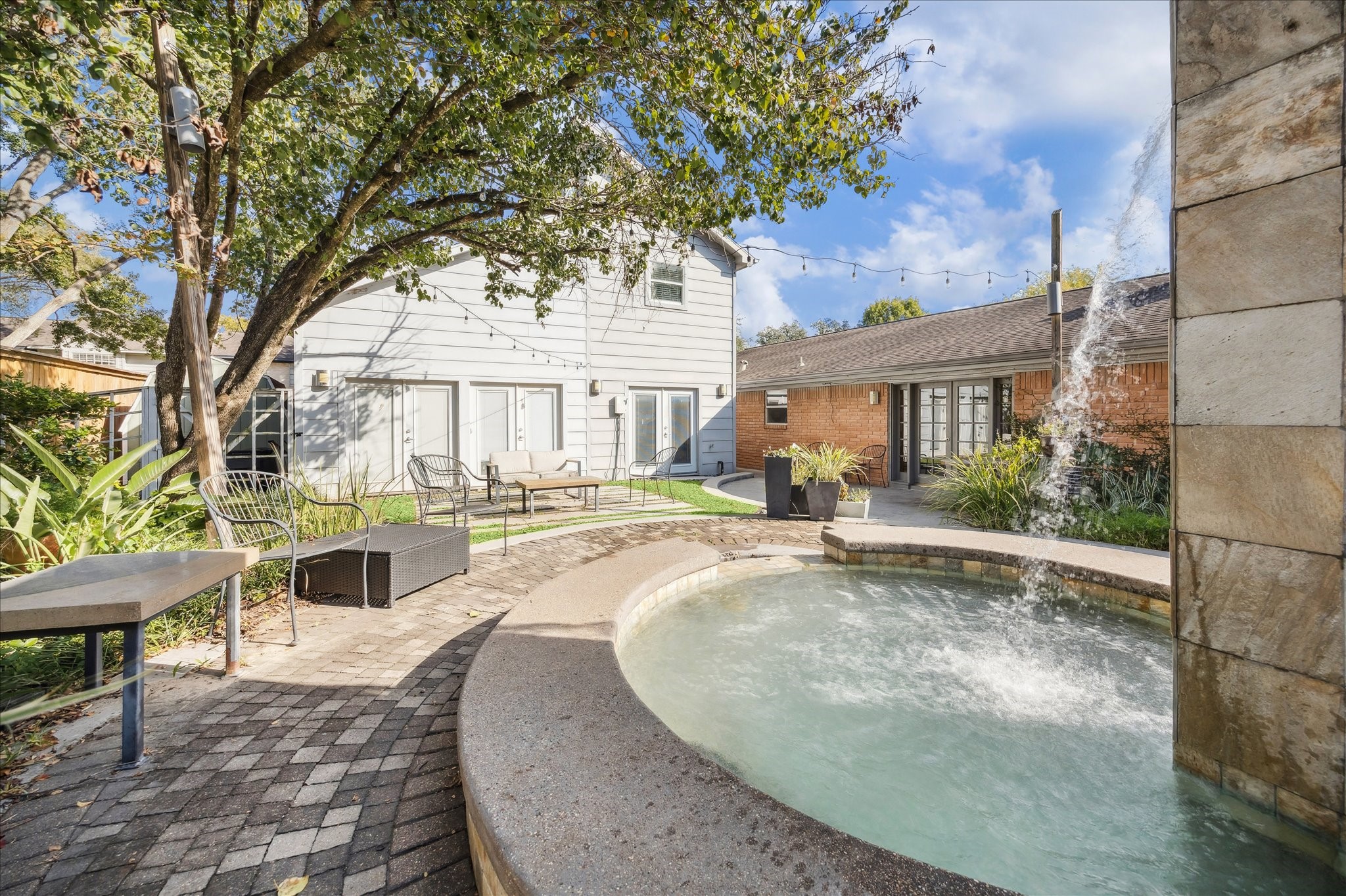 10102 Knoboak Drive Houston, TX 77080 - Photo 37 of 39 a view of a house with backyard porch and sitting area