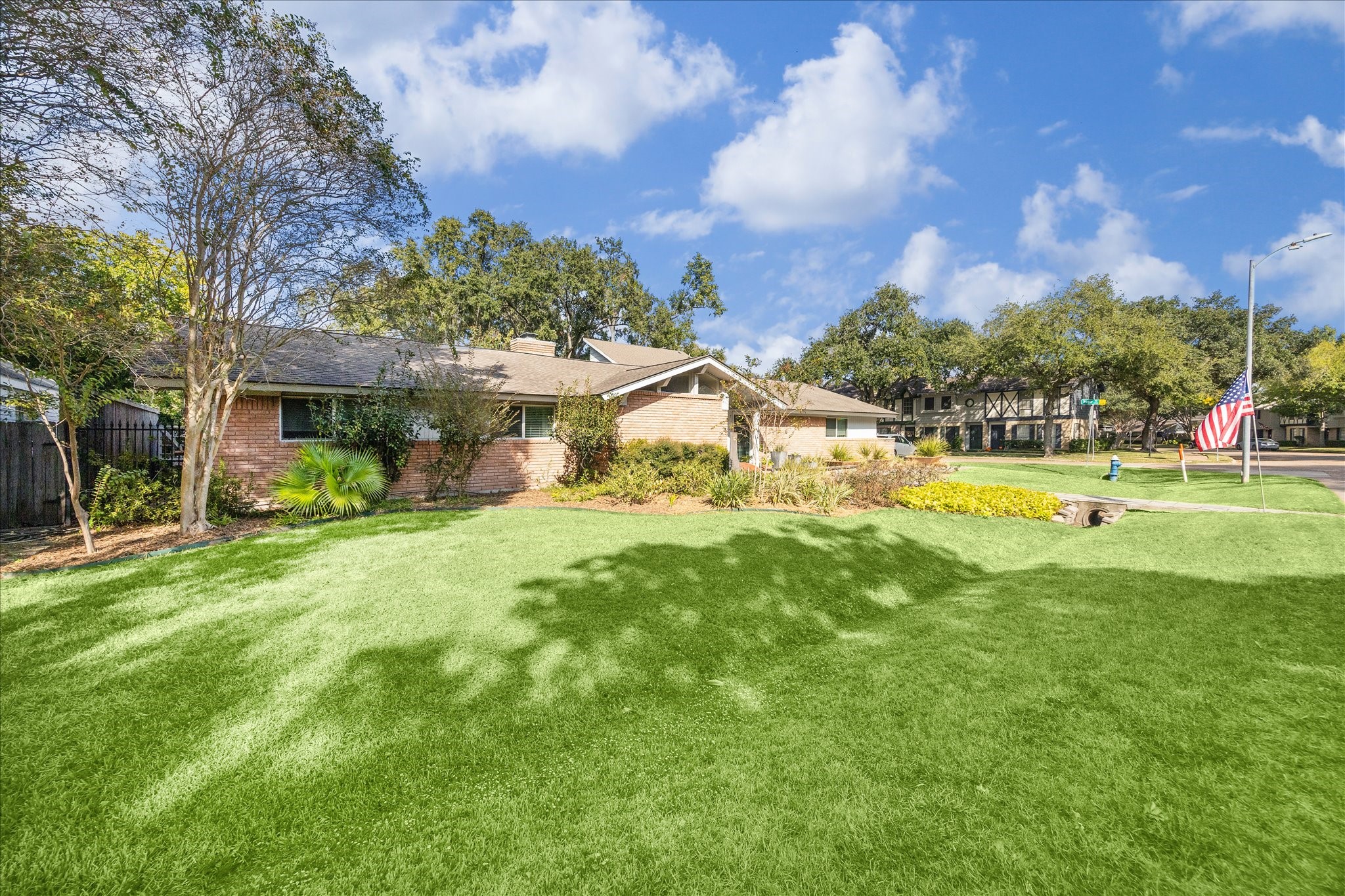 10102 Knoboak Drive Houston, TX 77080 - Photo 4 of 39 a view of a house with a big yard and a large tree