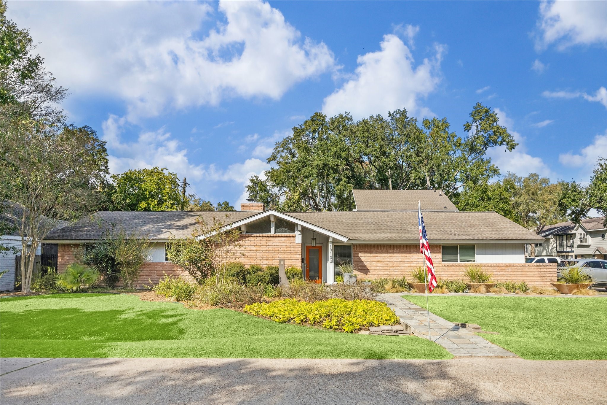 10102 Knoboak Drive Houston, TX 77080 - Photo 5 of 39 a front view of a house with a yard and garage