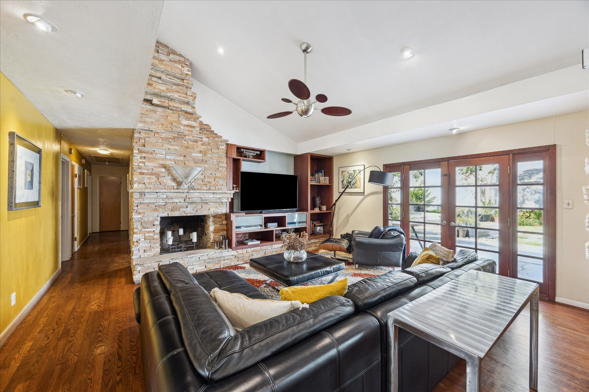 10102 Knoboak Drive Houston, TX 77080 - Photo 8 of 39 a living room with furniture a flat screen tv and a fireplace