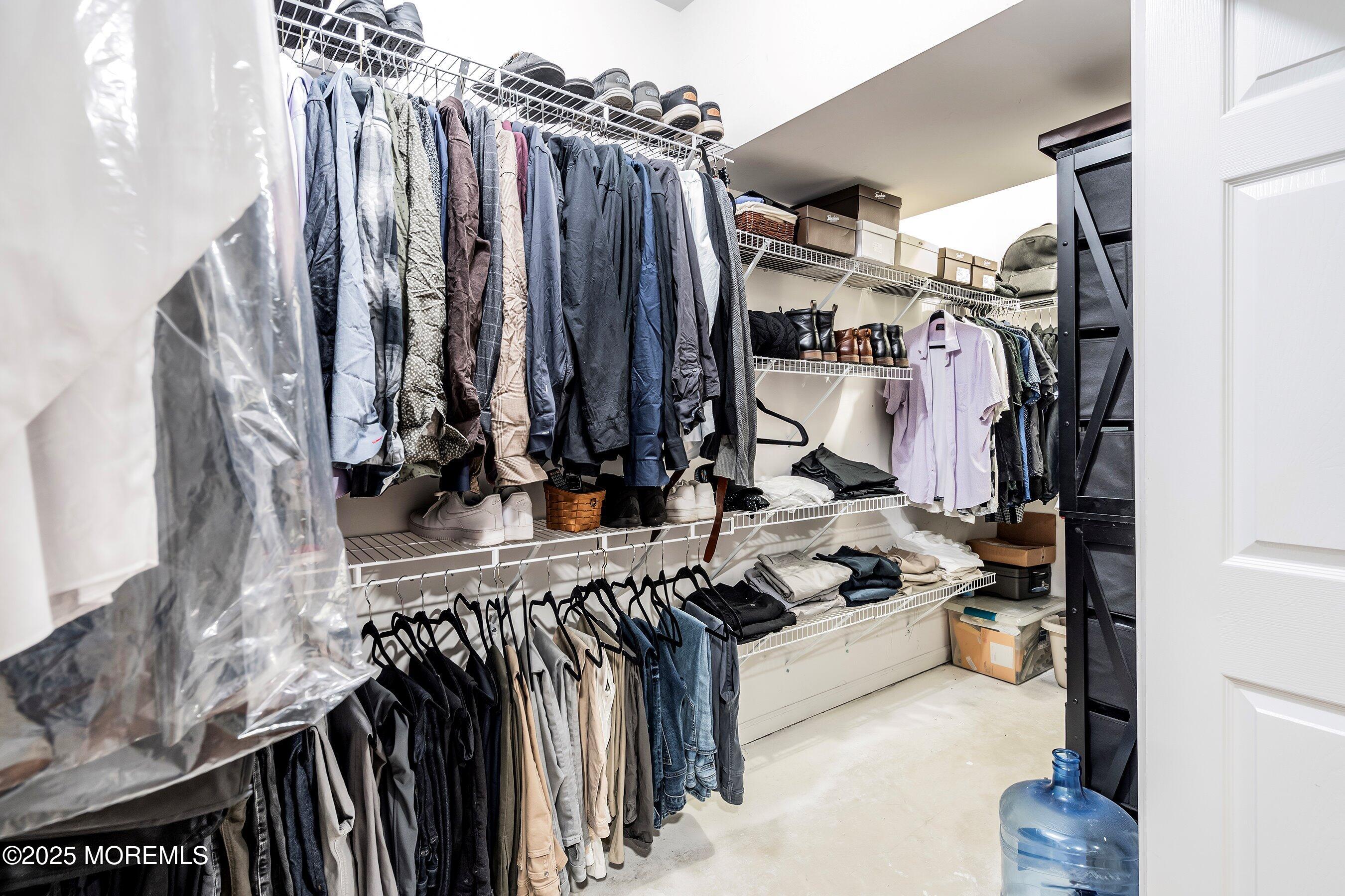 124 Barracuda Road Manahawkin, NJ 08050 - Photo 41 of 69 a view of walk in closet with clothes and shoes