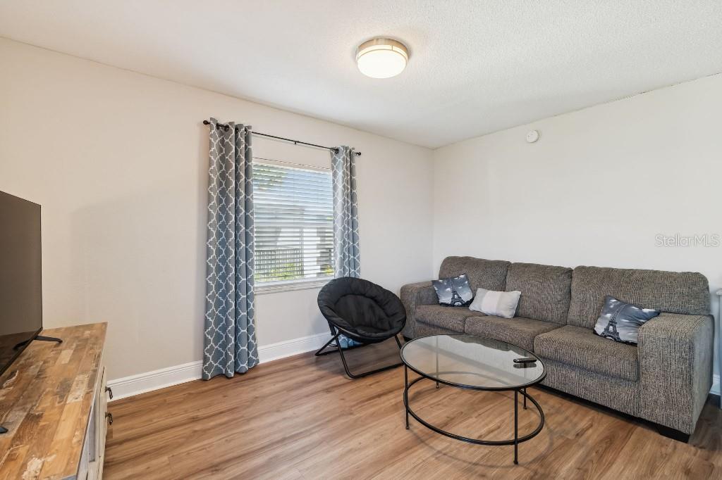 13125 Wilcox Road, Unit 6205 Largo, FL 33774 - Photo 15 of 48 a living room with furniture and a window