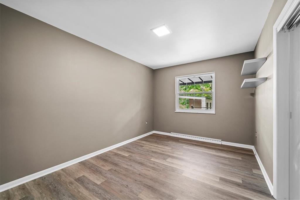 207 Ridge Avenue Freedom, PA 15042 - Photo 20 of 49 wooden floor in an empty room with a window