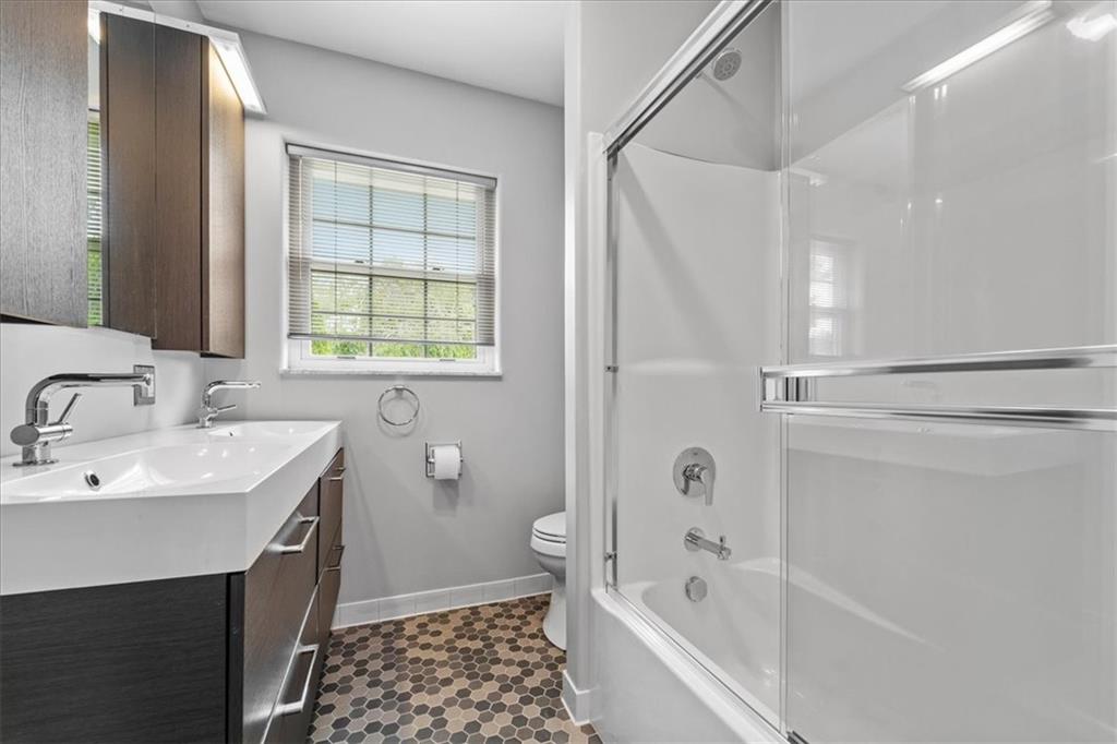 207 Ridge Avenue Freedom, PA 15042 - Photo 24 of 49 a bathroom with a bathtub shower sink vanity and a toilet
