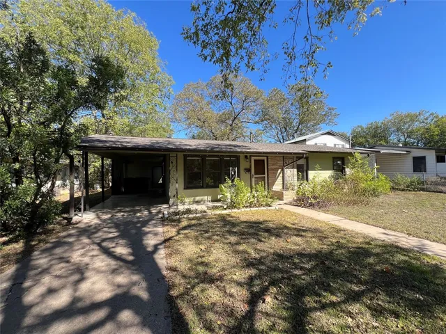 a front view of a house with a yard and porch