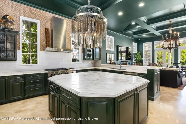 a kitchen with granite countertop a sink and a stove