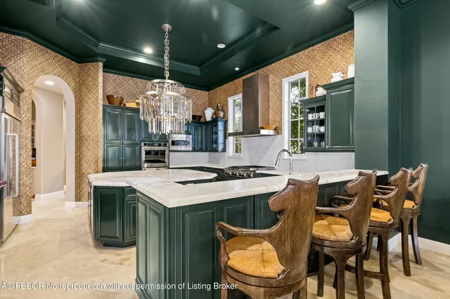 a kitchen that has a table and chairs in it