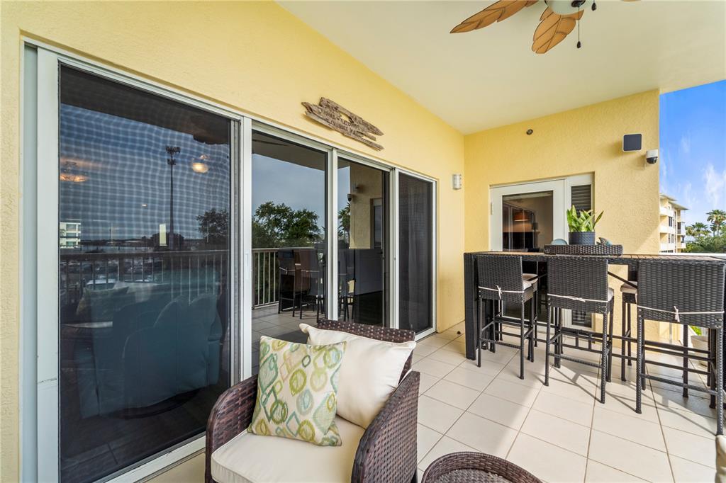 425 150th Avenue, Unit 2303 Madeira Beach, FL 33708 - Photo 28 of 69 a outdoor living space with furniture