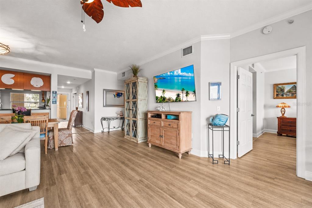 425 150th Avenue, Unit 2303 Madeira Beach, FL 33708 - Photo 29 of 69 a living room with furniture and a flat screen tv