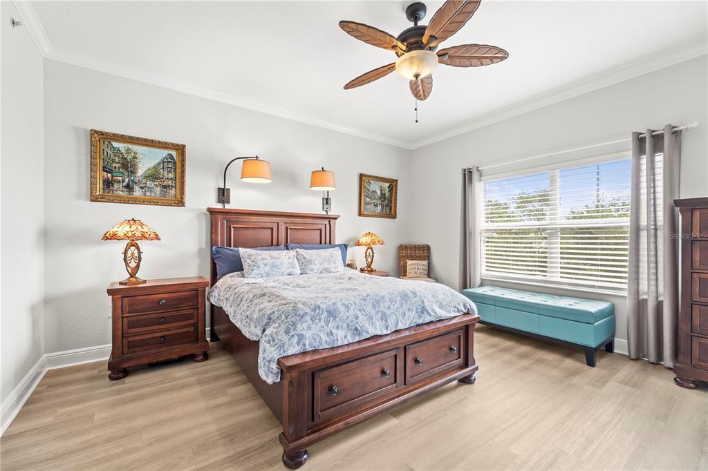425 150th Avenue, Unit 2303 Madeira Beach, FL 33708 - Photo 30 of 69 a bed room with a bed and a baby bed