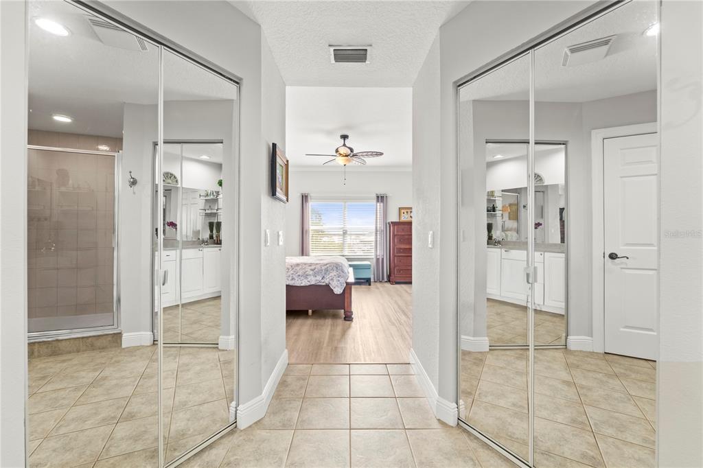 425 150th Avenue, Unit 2303 Madeira Beach, FL 33708 - Photo 38 of 69 a bathroom with a glass shower door and a bathroom
