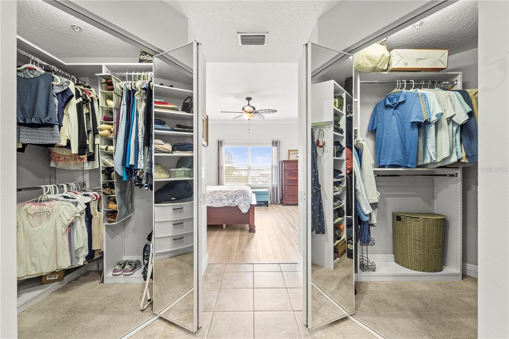 425 150th Avenue, Unit 2303 Madeira Beach, FL 33708 - Photo 39 of 69 a view of walk in closet with clothes and shoes