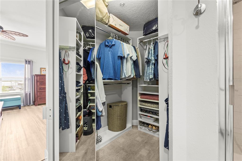 425 150th Avenue, Unit 2303 Madeira Beach, FL 33708 - Photo 40 of 69 a view of walk in closet with clothes and shoes