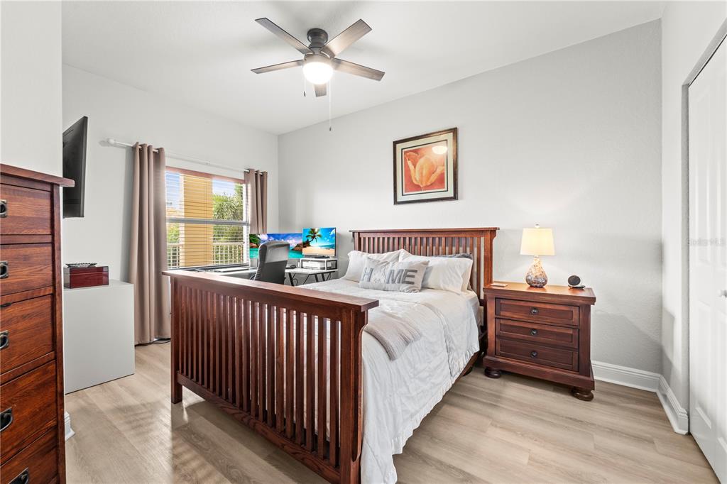 425 150th Avenue, Unit 2303 Madeira Beach, FL 33708 - Photo 44 of 69 a bedroom with a bed and a large window