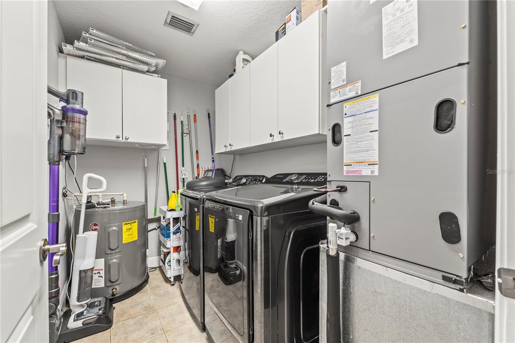 425 150th Avenue, Unit 2303 Madeira Beach, FL 33708 - Photo 52 of 69 a view of water heater room