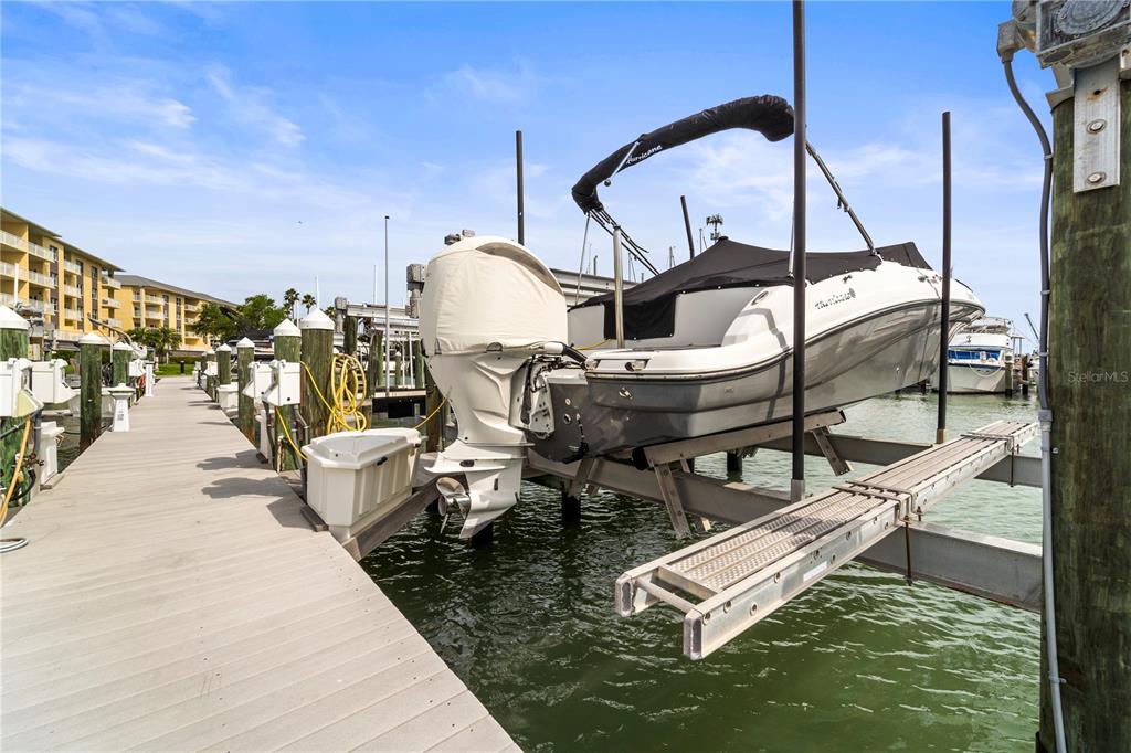 425 150th Avenue, Unit 2303 Madeira Beach, FL 33708 - Photo 55 of 69 a roof deck with table and chairs
