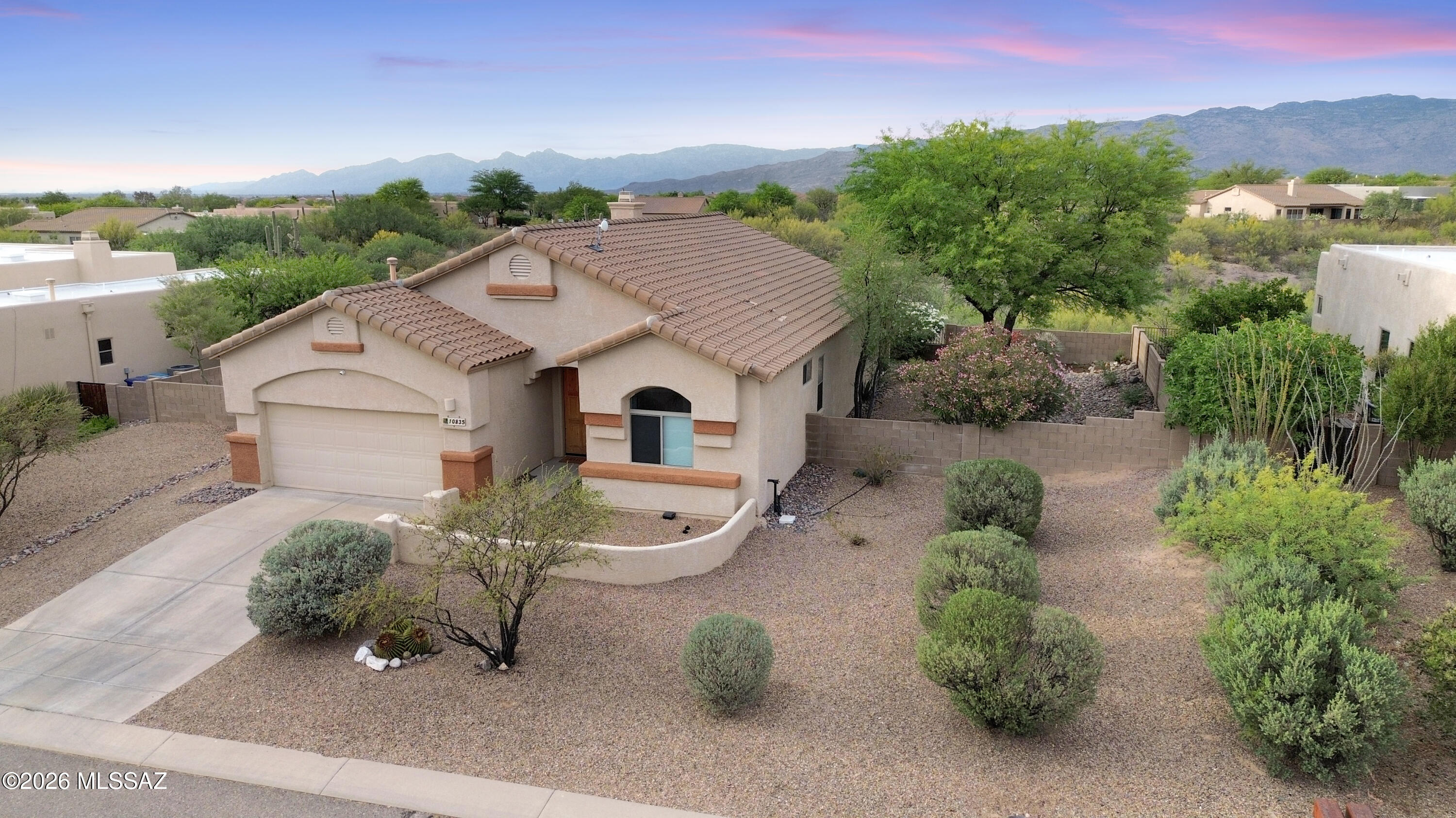10835 South Heart Break Ridge Place Vail, AZ 85641 - Photo 44 of 49 a view of a white house with a yard and outdoor seating