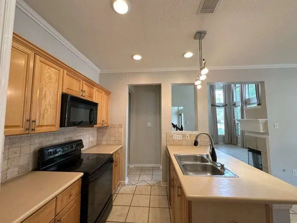 a view of a livingroom with wooden floor and a window