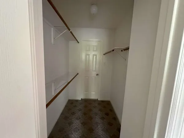 a big room with windows and closet