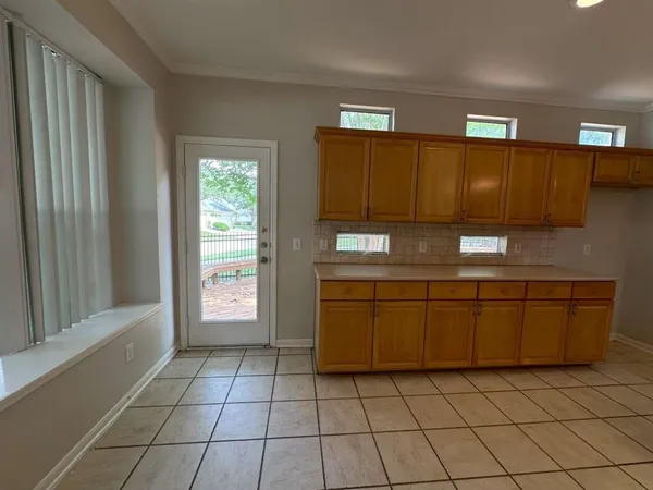 a view of house with backyard and seating space