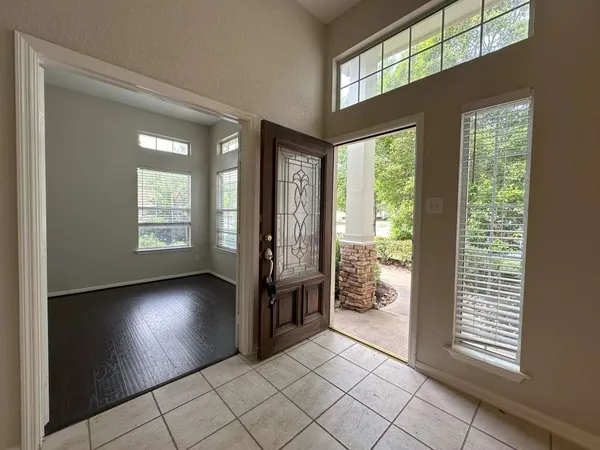 a view of entryway with a front door and windows