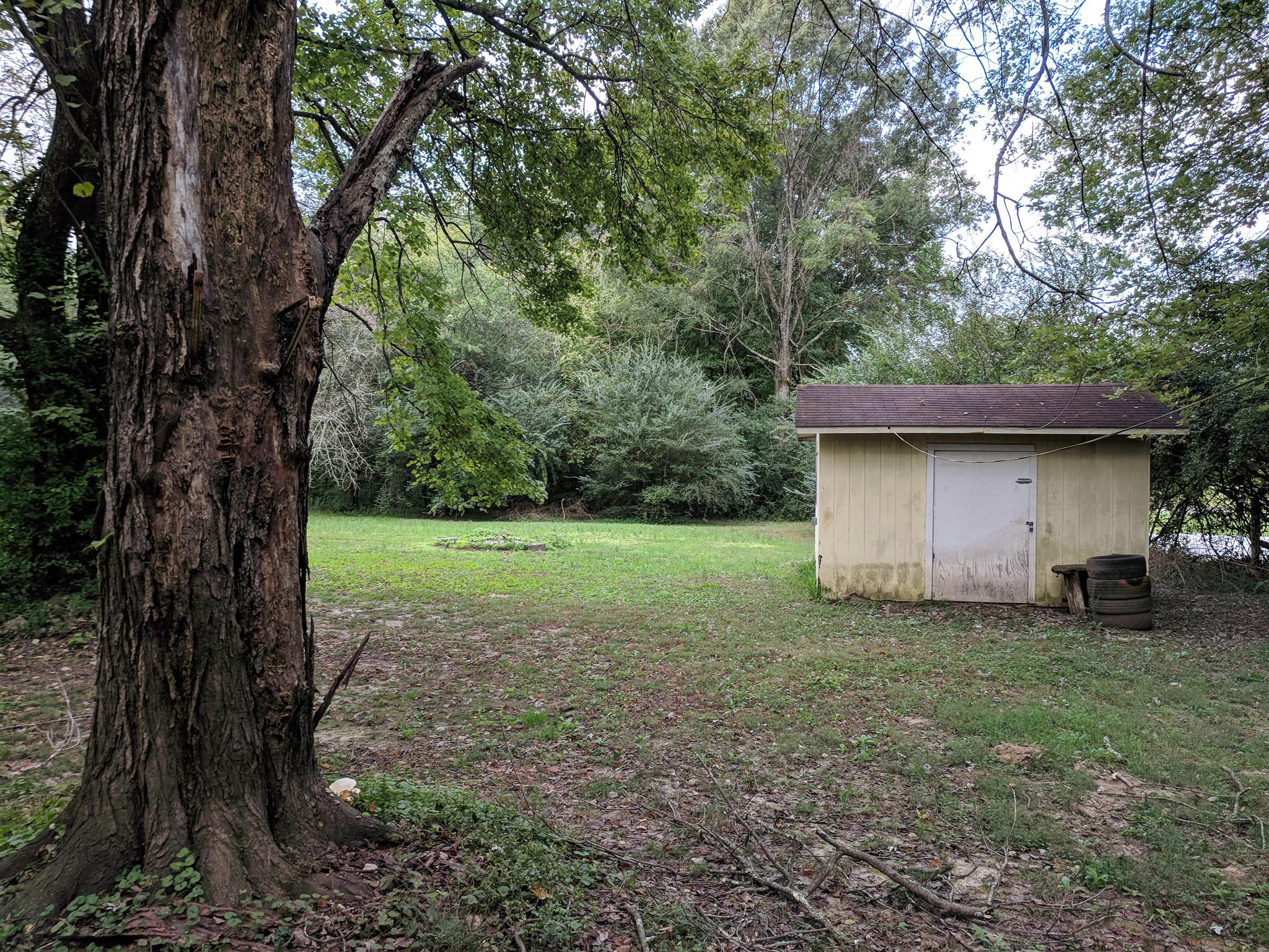 1405 Ovoca Road Tullahoma, TN 37388 - Photo 16 of 16 Fully fenced, large back yard with mature trees. Extra storage shed with electric.