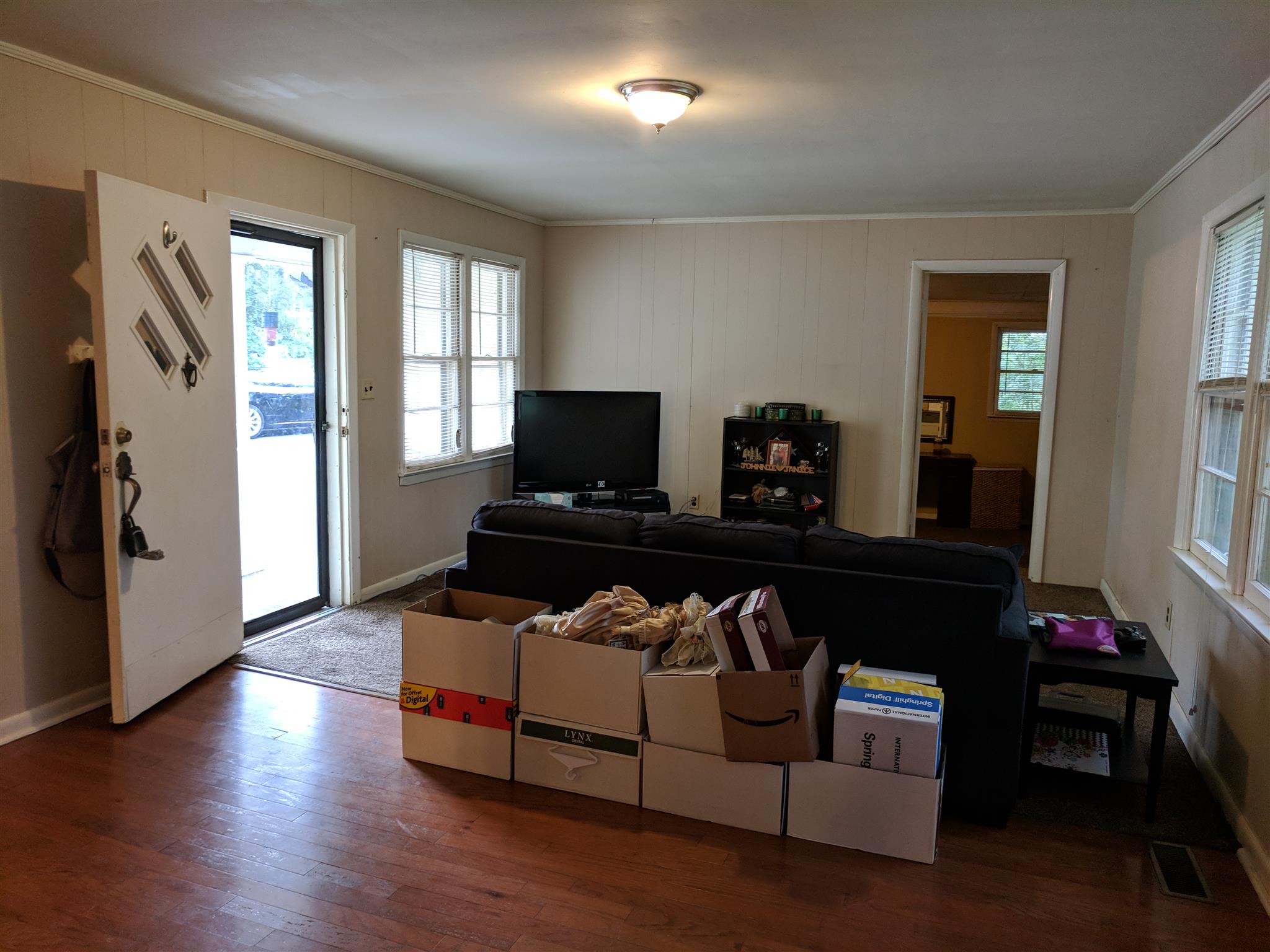 Living room and dining area. Lots of natural light. 