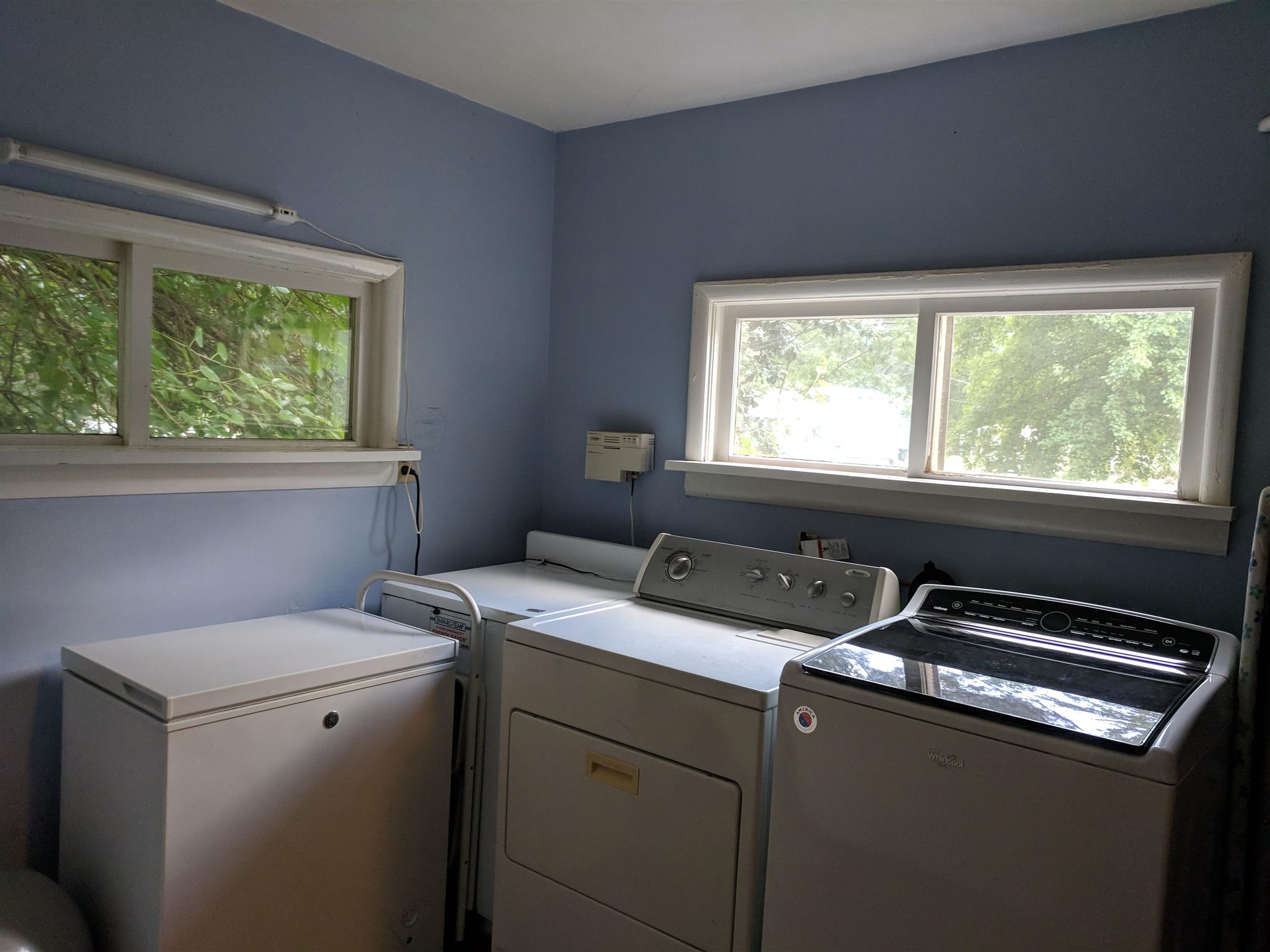 Large laundry room. Has extra storage and counter space.