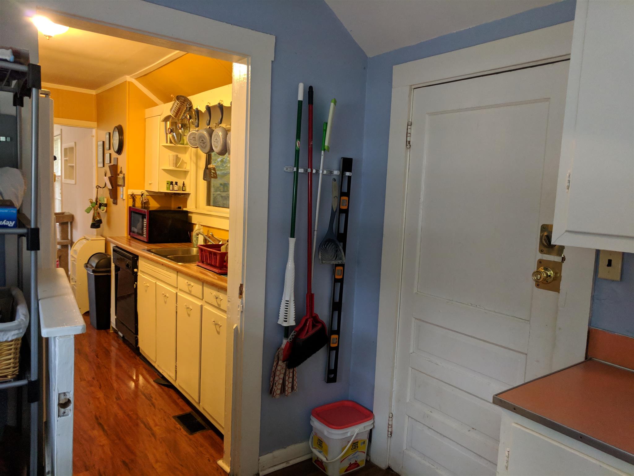 Laundry with door out to porch, back yard.