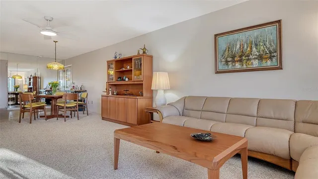 a bedroom with a bed and large window