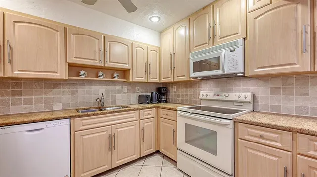 a bedroom with a bed and a cabinets