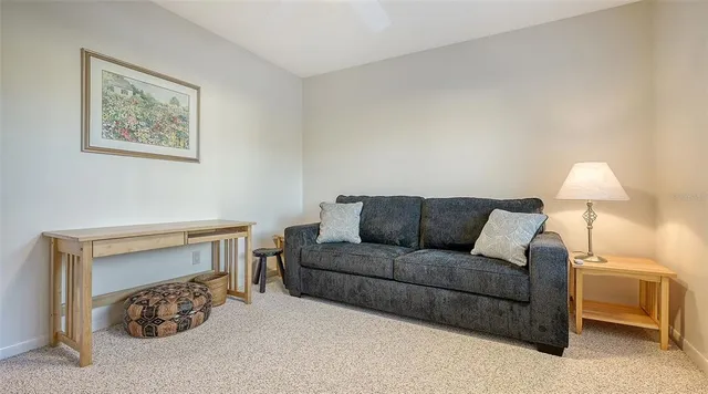 a view of a lake with a house and a big yard