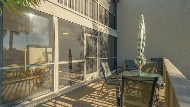 a view of a balcony with furniture