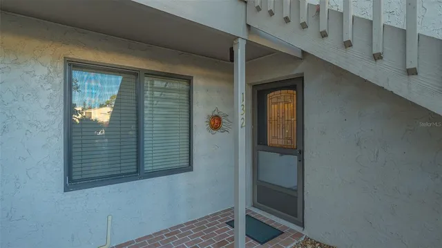 a view of a dining room with furniture and window