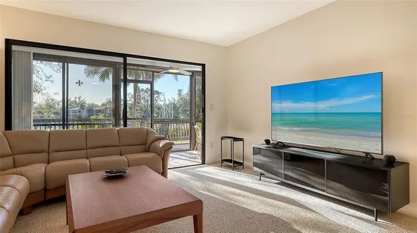 a view of a balcony with chairs and a table