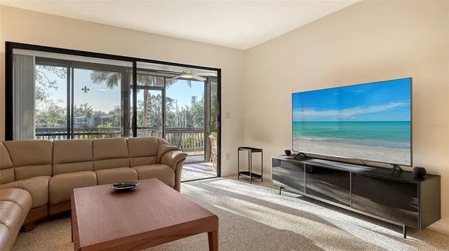 a view of a balcony with chairs and a table