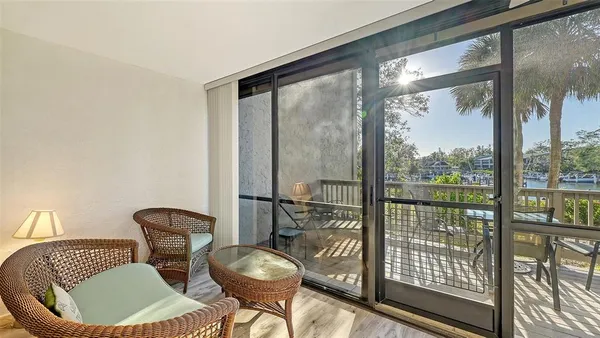 a view of a chairs and table on the deck
