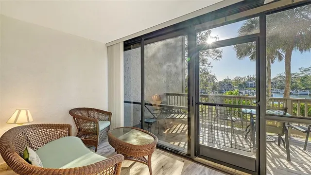 a view of a chairs and table on the deck